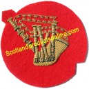 Bagpipe Gold On Red Badge
